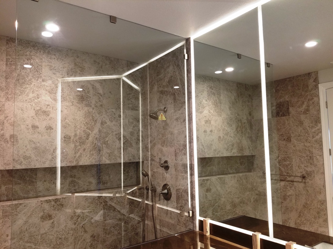 Large mirrors and glass shower