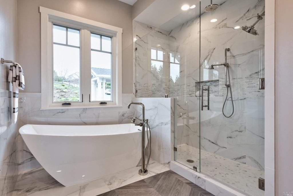 Free standing white tub and Rocky Knoll Glass shower enclosure