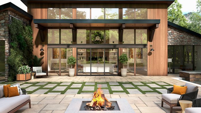 Expansive glass windows and doors look out on a modern patio 