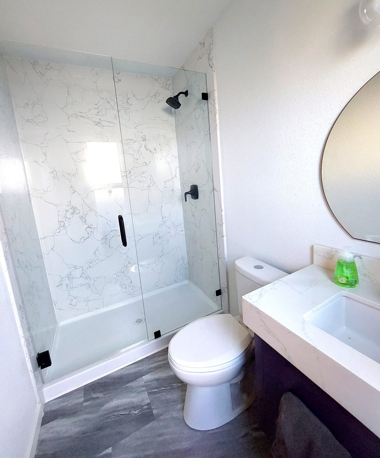 A Modern Bathroom with a Glass Shower Dick's Rancho Glass